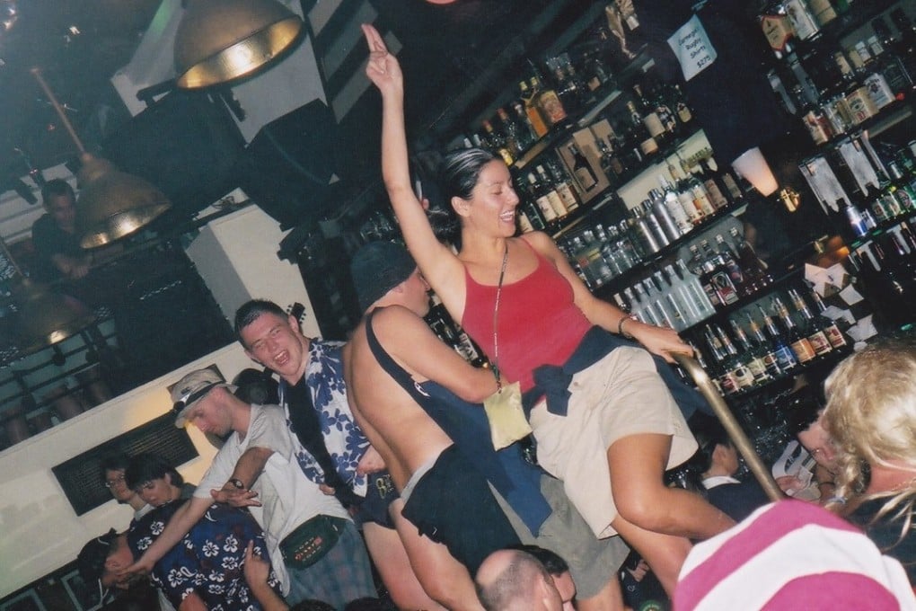 Revellers get up on the bar during another wild night at Carnegie's in the 1990s, when the party never seemed to end. Photo: Carnegie's Hong Kong Facebook group