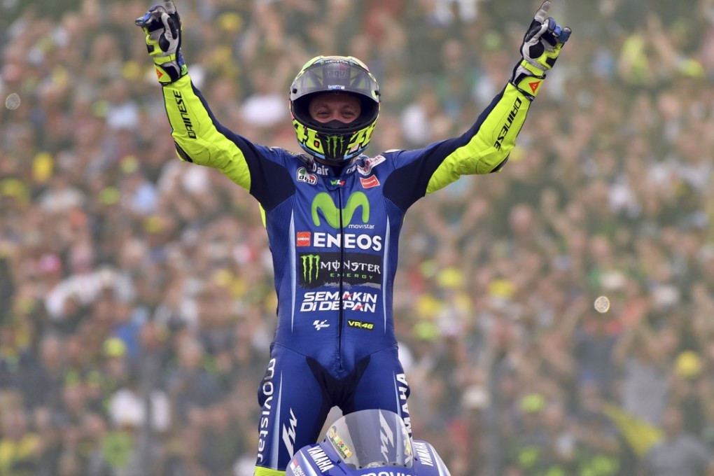 Moto GP rider Valentino Rossi of Italy celebrates after winning the Dutch Motorcycle Grand Prix in Assen. Photo: AP