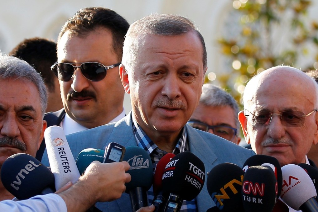 Turkey's President Recep Tayyip Erdogan talks to reporters after the Eid al-Fitr prayers in Istanbul, Turkey. Photo: Reuters