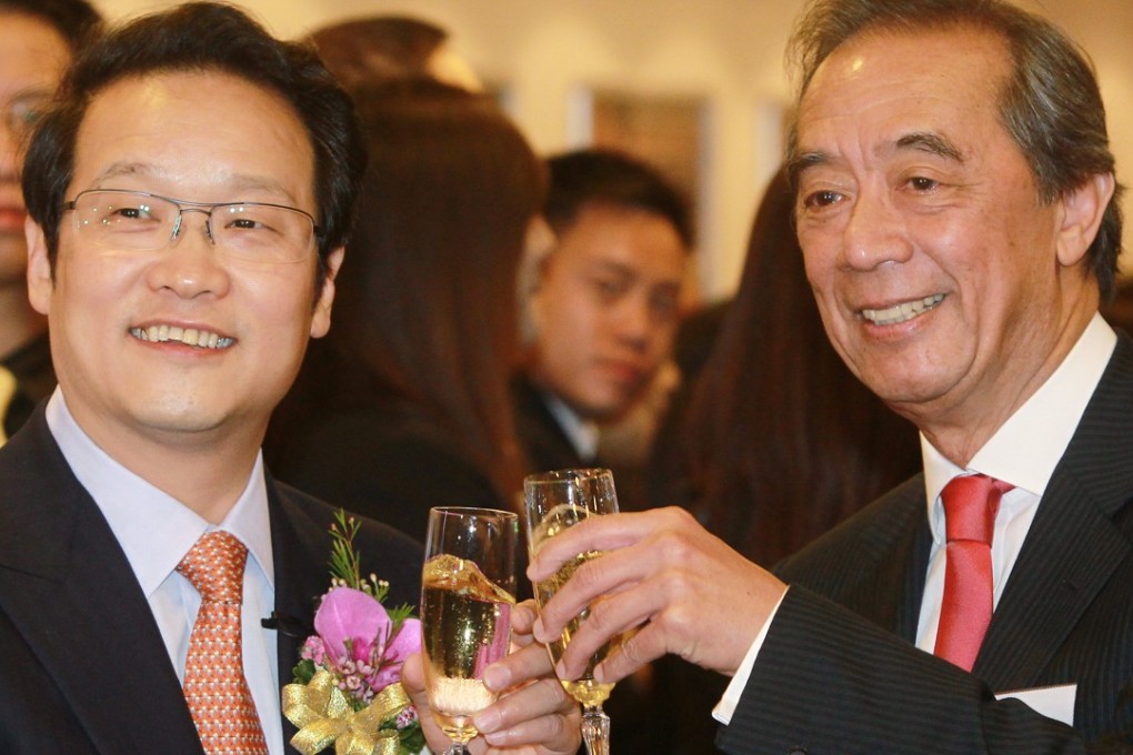 Ronald Arculli (R), the then chairman of Hong Kong Stock Exchange and Chairman of Agricultural Bank of China Xiang Junbo toast at the Agricultural bank listing ceremony in July 2010. Photo: K. Y. Cheng