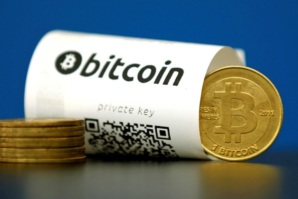 A Bitcoin (virtual currency) paper wallet with QR codes and a coin are seen in an illustration picture taken at La Maison du Bitcoin in Paris, France. Photo: REUTERS/Benoit Tessier