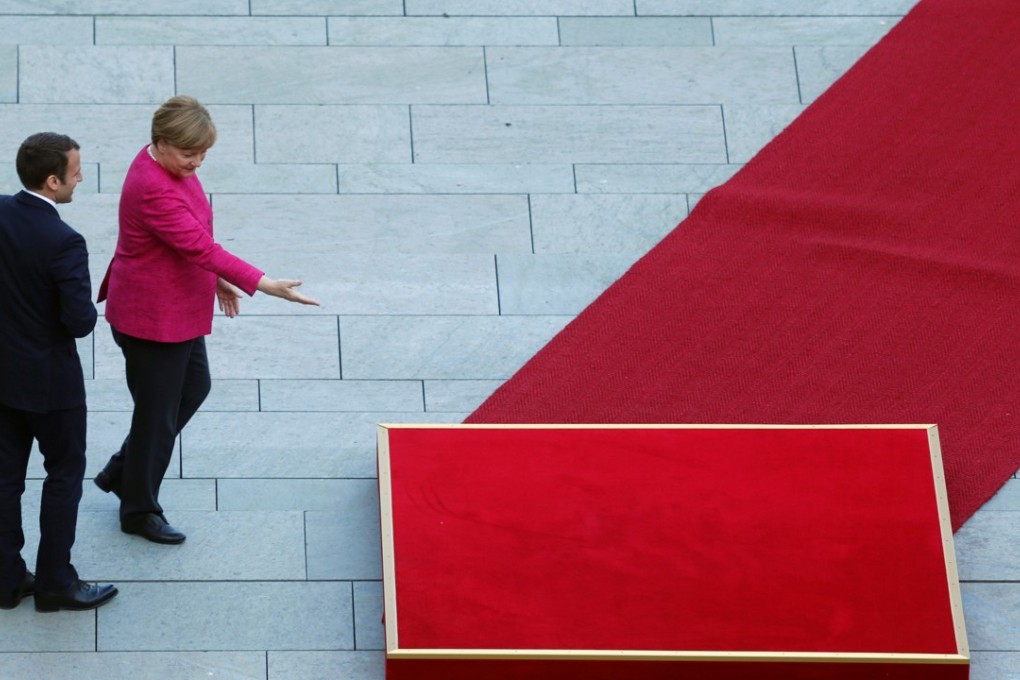 German Chancellor Angela Merkel and French President Emmanuel Macron arrive at a ceremony at the Chancellery in Berlin on May 15. Photo: Reuters