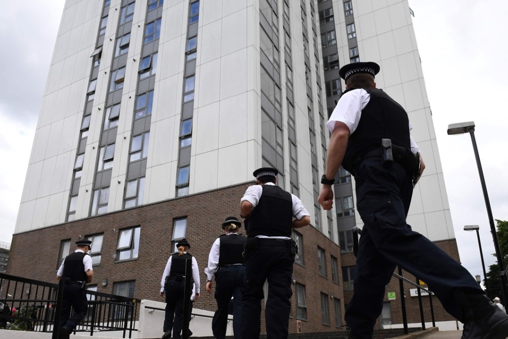Police officers arrive at Dorney Tower residential block on the Chalcots Estate in north London on Sunday, whose residents were evacuated due to fire safety fears in the wake of the Grenfell Tower tragedy. Photo: AFP