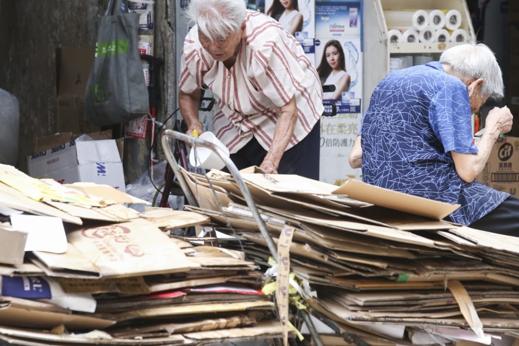 There have been calls to look into less strict enforcement rules for unlicensed hawkers, especially in the case of ‘cardboard grannies’, poor elderly women who collect and sell used carton boxes. Photo: Dickson Lee