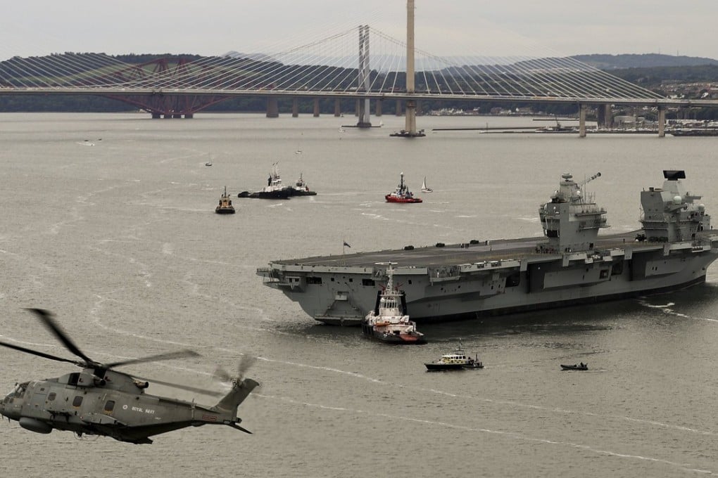 HMS Queen Elizabeth, the first QE Class aircraft carrier, departs the dockyard in Rosyth, Scotland, on Monday. Photo: AFP