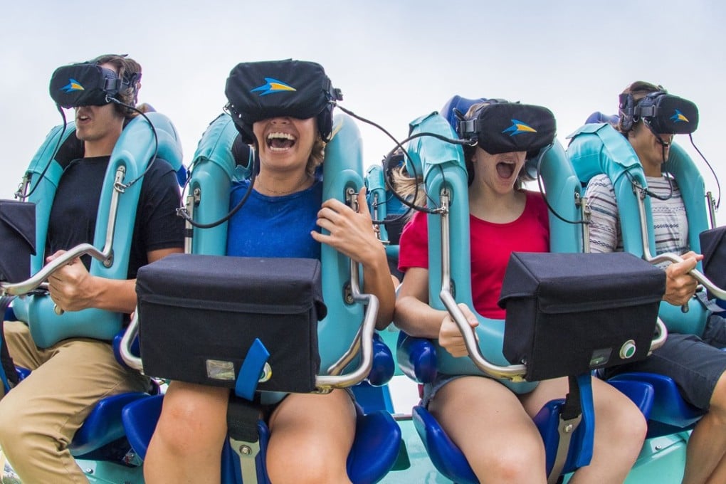 As the “Kraken” roller coaster speeds through a loop and turns upside down, virtual reality headsets send the riders on an undersea adventure, at SeaWorld Orlando in Florida. Photo: TNS