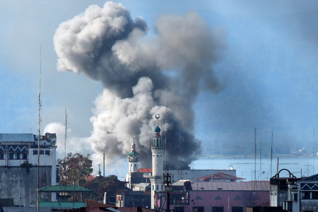 An explosion caused by Philippine army aircraft bombing militant areas of Marawi. Photo: Reuters