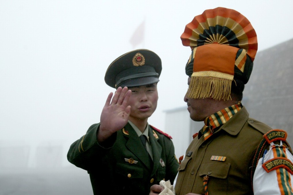 A file picture of Chinese and Indian guards at the Nathu La border crossing. Photo: AFP
