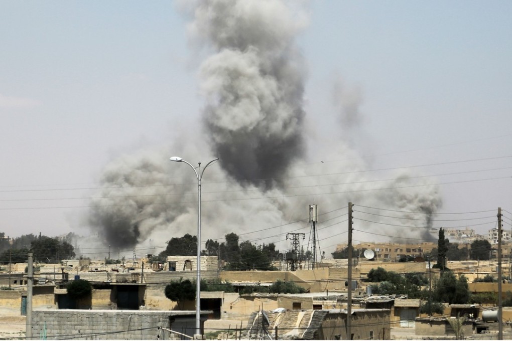 Smoke billows from buildings in the northern Syrian city of Raqqa during an offensive by US-backed fighters to retake the Islamic State group bastion. Photo: AFP