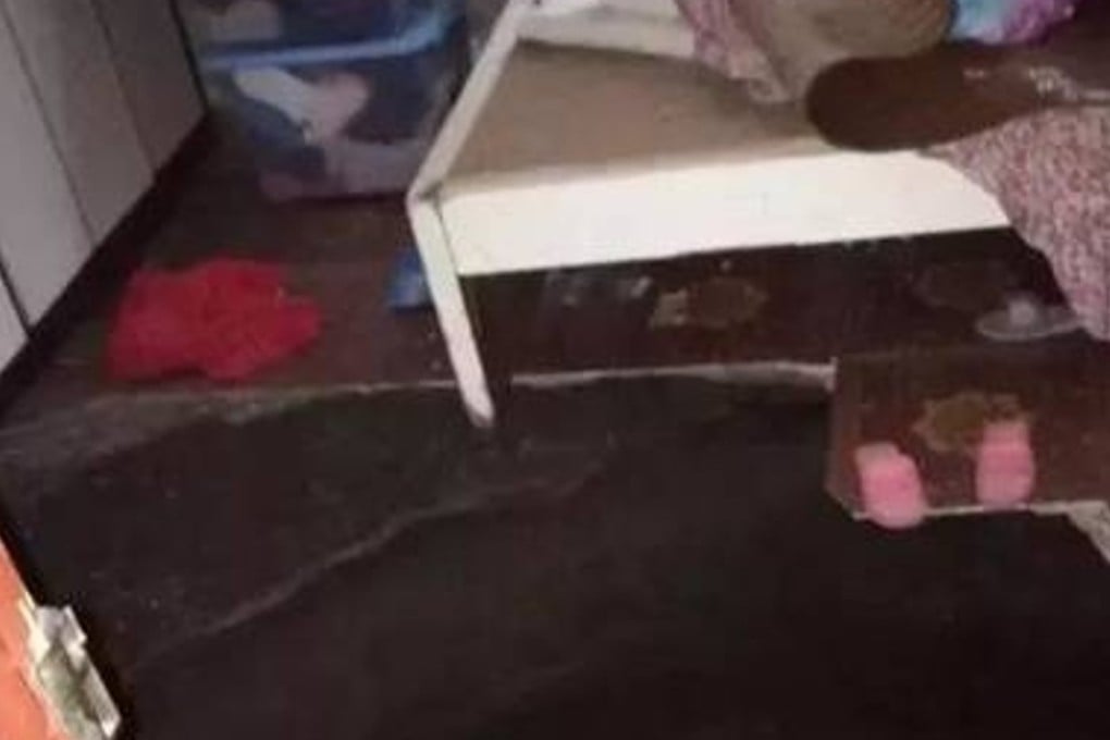 An empty bed stands beside a gaping hole in the missing woman’s bedroom floor. A rescue effort to find the 45-year-old had to be called off due to the dangerous conditions. Photo: Handout