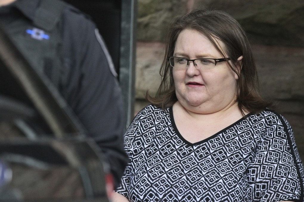 Elizabeth Wettlaufer is escorted by police from the courthouse in Woodstock, Ontario, on Monday after she was sentenced to life in prison with no eligibility for parole for 25 years. Photo: AP