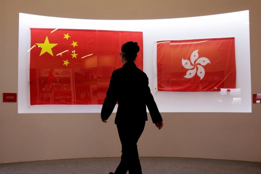 The flags of the People’s Republic of China and the Hong Kong Special Administrative Region stir a range of emotions for many residents in the former British colony. Photo: Reuters