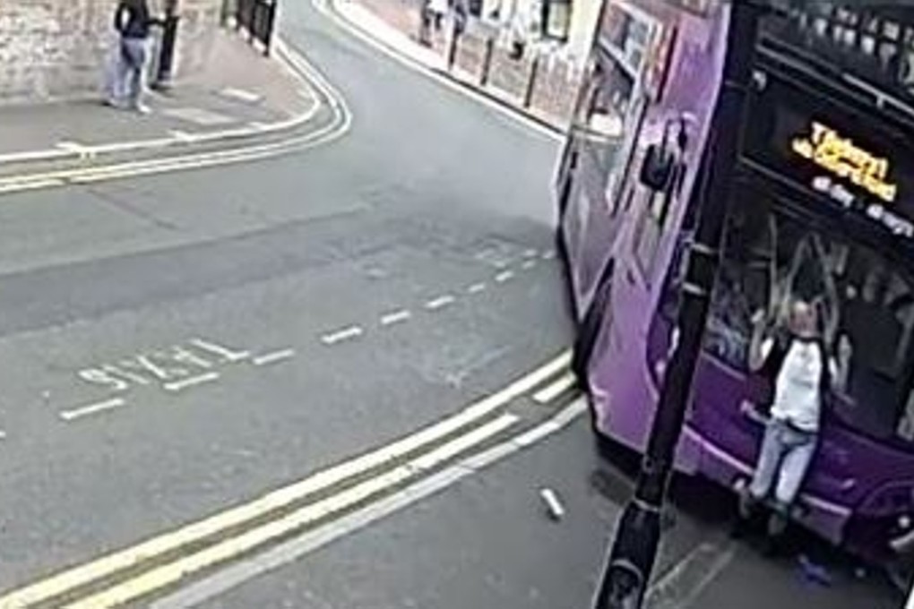 The bus slams into hapless pedestrian Simon Smith in Reading, England, on Saturday. Photo: BBC / YouTube
