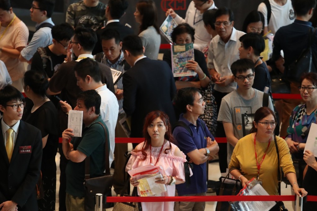 Long queues at the sales office of Cheung Kong Property Holdings' Ocean Pride at Fortune Metropolis in Hung Hom this month. Photo: Nora Tam