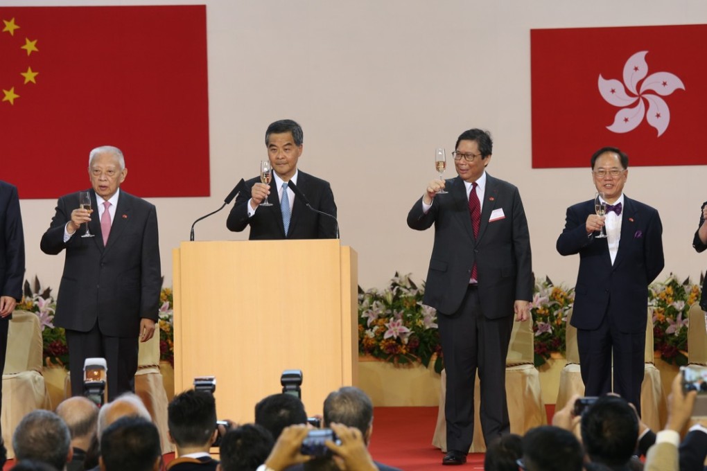 Chief Executive Leung Chun-ying officiates at the reception for the 19th anniversary of the establishment of the Hong Kong SAR last year, along with his predecessors Tung Chee-hwa (second left) and Donald Tsang (second right), and now chief executive-elect, Carrie Lam. Joining the toast is the liaison office director, Zhang Xiaoming (far left). Photo: Dickson Lee