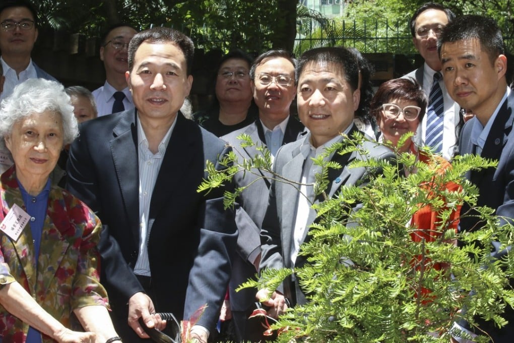 The three astronauts: Jing Haipeng (left); Yang Liwei (second from right); and Chen Dong (right) in Hong Kong on Wednesday. Photo: K. Y. Cheng