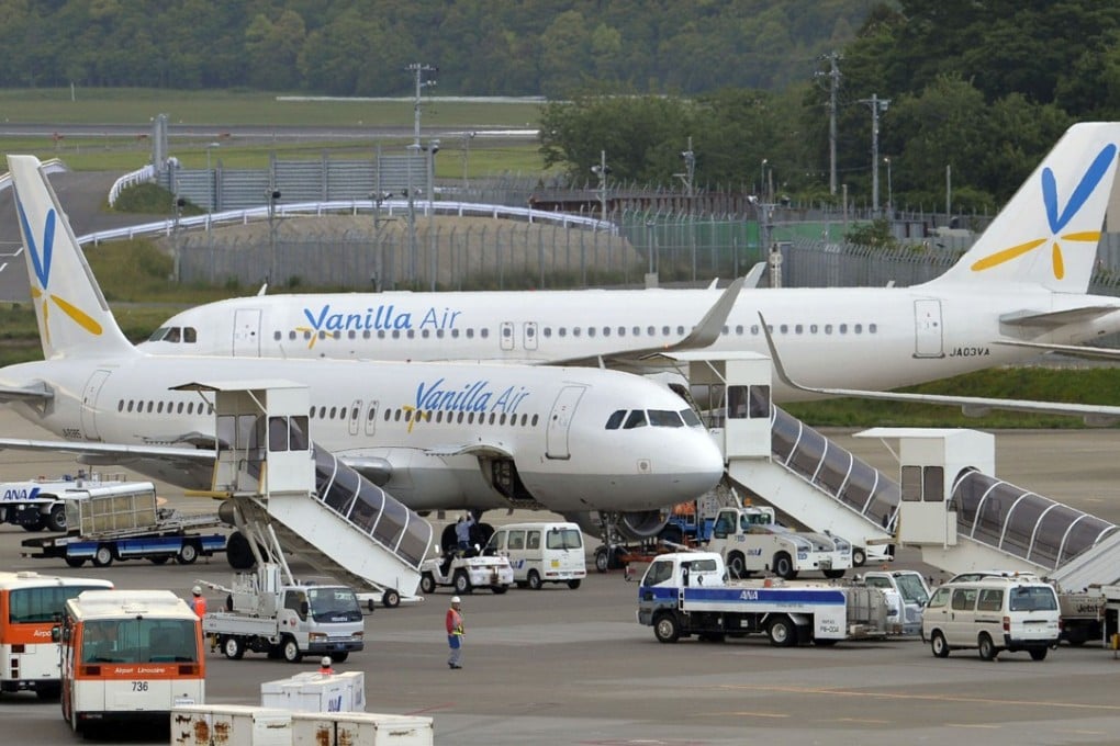 Japanese budget airline Vanilla Air has apologised to a wheelchair user after he crawled up boarding stairs in a dispute with a staffer at an airport in southern Japan. Photo: Kyodo