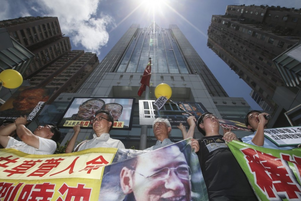 Demosisto and the League of Social Democrats met outside the Western Police Station on June 27, 2017 to march to the Central Liaison Office and call for the full release of Liu Xiaobo in the Western District. Photo: K. Y. Cheng