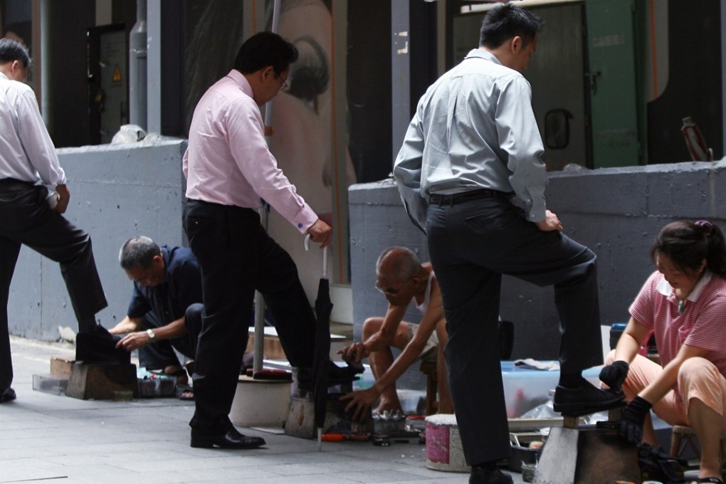Shoe shiners are now a rare sight on Hong Kong streets. Photo: David Wong