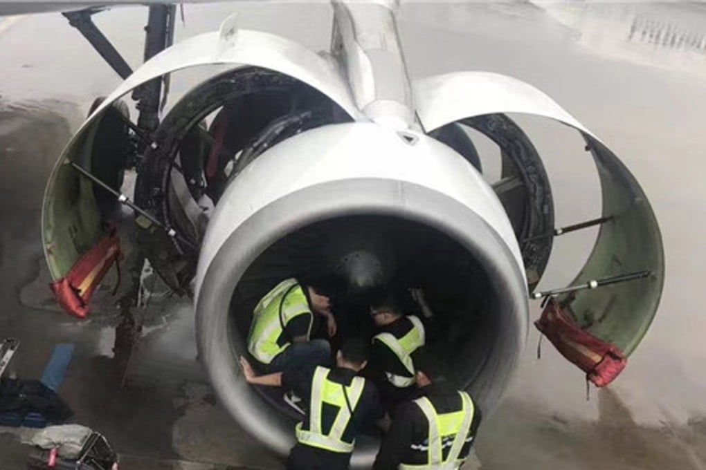 Ground crew inspect the engine of China Southern Airlines Flight 380 at Shanghai airport. Photo: Handout