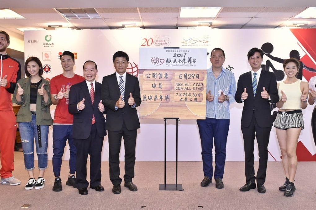 Duncan Reid (left), Lo Yi-ting (third left) and Wilson Shum Ho-kit (third right) help confirm the details of the game. Photos: Handout