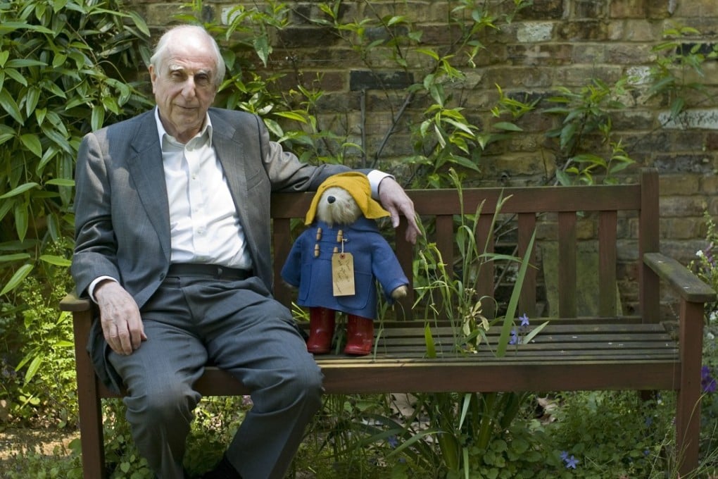 Author Michael Bond sits with a Paddington Bear toy. Photo: AP