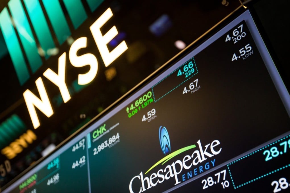 A monitor displays Chesapeake Energy signage on the floor of the New York Stock Exchange (NYSE) as Wall Street declined after the US Senate delayed its vote on repealing Obamacare. Photo: Bloomberg