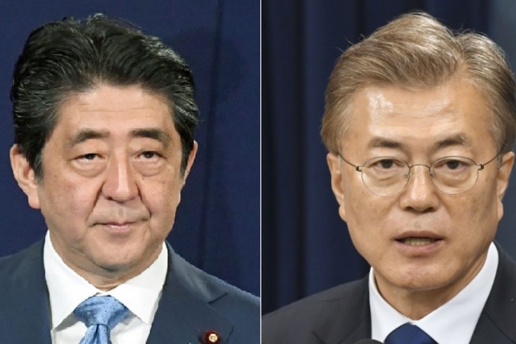 South Korean President Moon Jae-in (right) has made improved ties with Japan under Prime Minister Shinzo Abe a priority for his government, but obstacles remain to sustained reconciliation. Photo: Kyodo