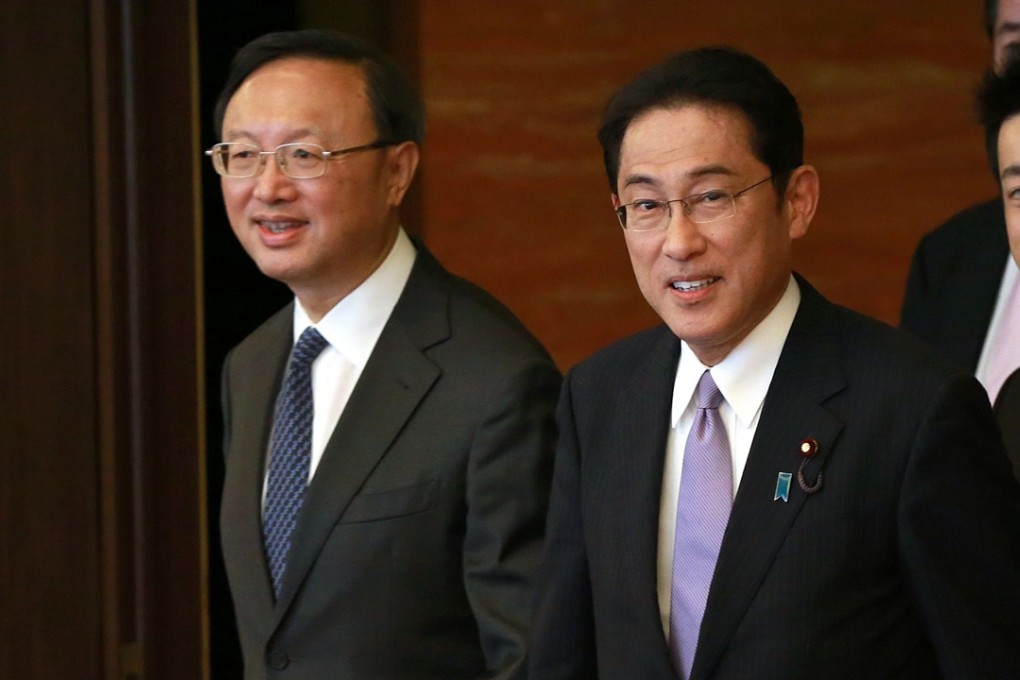 China's State Councilor Yang Jiechi (left) pictured with Japan's Foreign Minister Fumio Kishida (centre) during his trip to Tokyo at the end of last month. Some analysts suggested the meeting showed ties were improving between the two nations. Photo: AFP