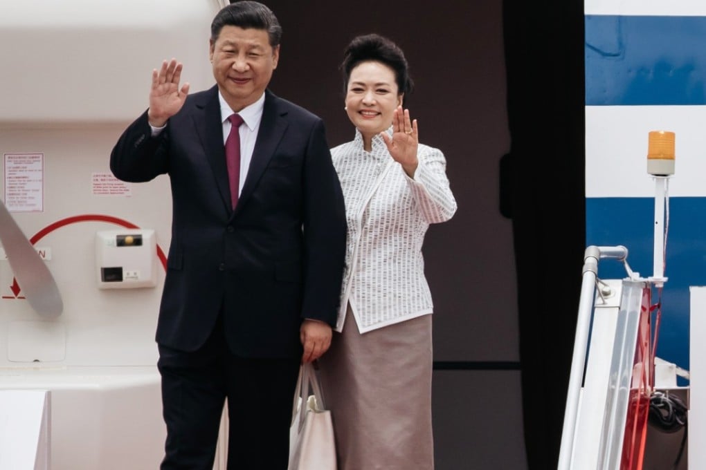 President Xi Jinping and his wife, Peng Liyuan, arrive in Hong Kong to celebrate the 20th anniversary of its return to China. Photo: Bloomberg