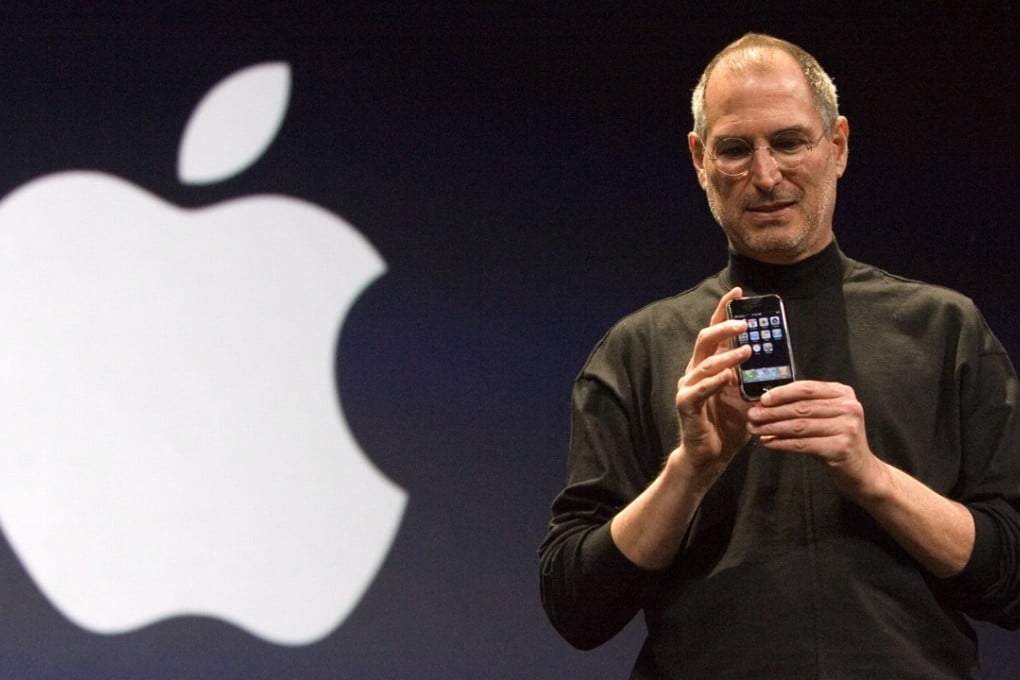 Apple Inc CEO and co-founder, Steve Jobs poses with the new Apple iPhone after his keynote at the Macworld Expo in San Francisco, California, on January 9, 2007. The revolutionary mobile phone was officially launched on June 29 that year. Photo: EPA
