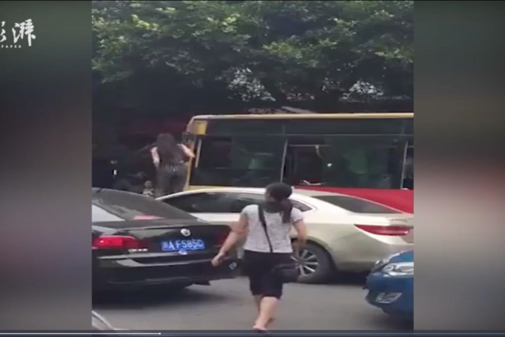 The woman seen in video footage clambering onto the bonnet of her car. Photo: Handout