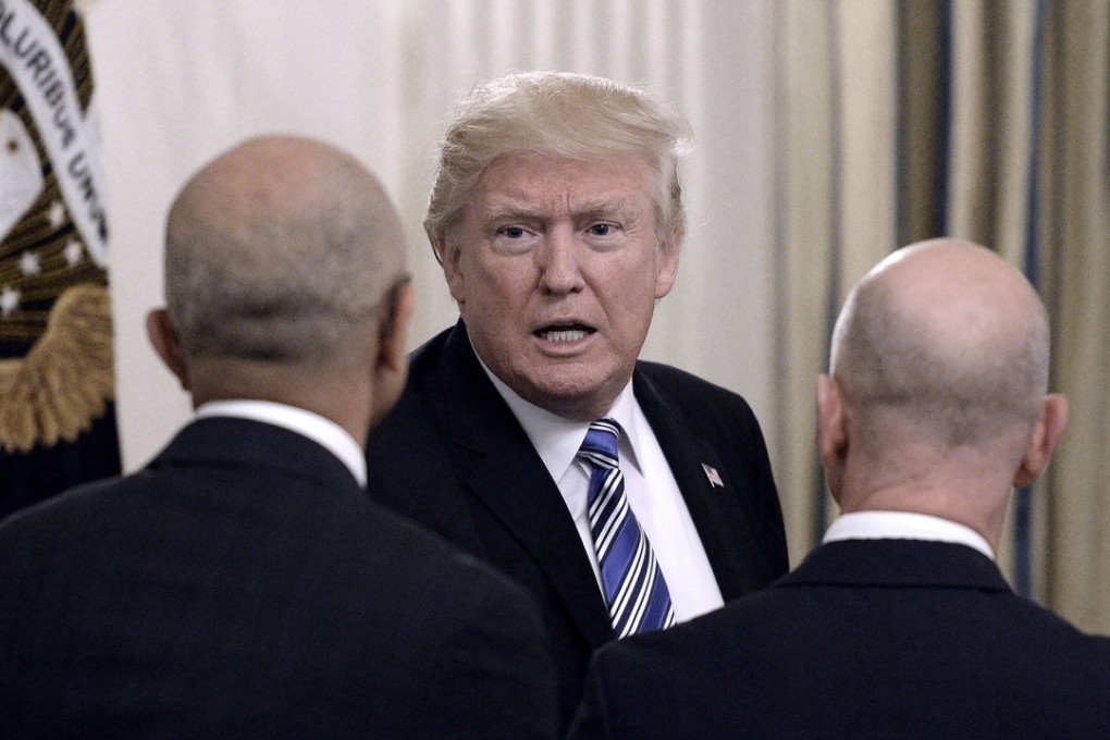 US President Donald Trump greets Microsoft CEO Stya Nadella, left, and Amazon CEO Jeff Bezos during a meeting of the American Technology Council on Monday, June 19, 2017 in the State Dining Room of the White House in Washington. Trump on Wednesday attacked the Bezos-owned Washington Post and the online giant he owns, Amazon.com. Photo: Abaca Press/TNS