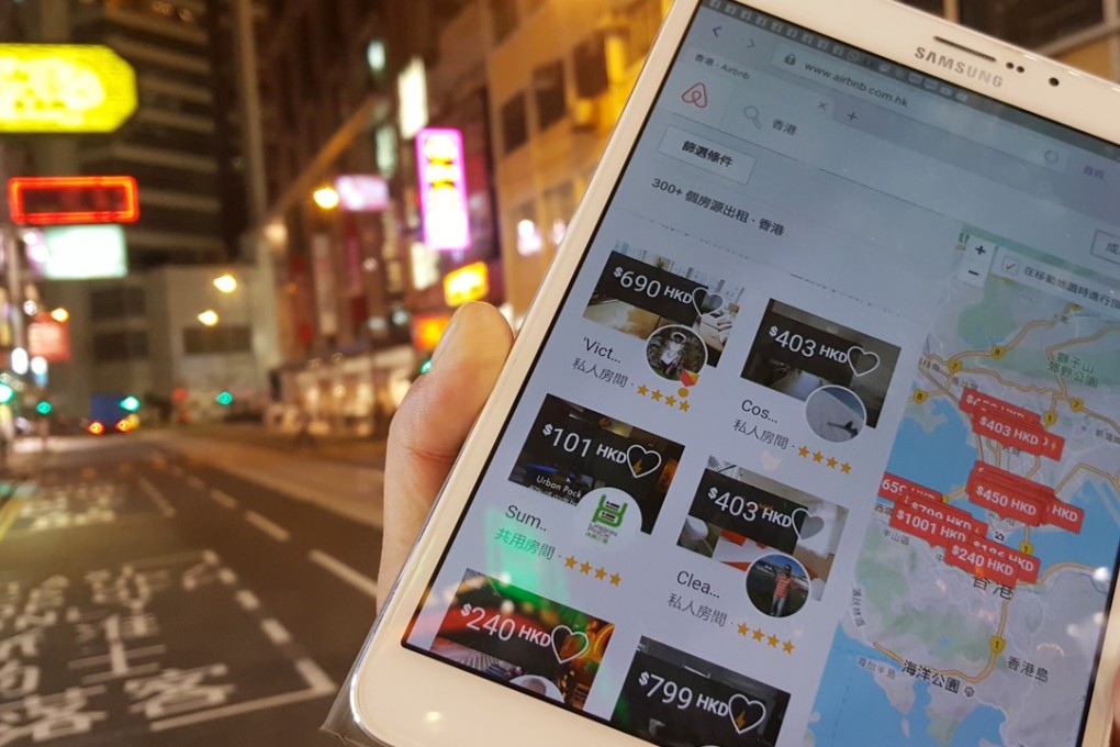 A tourist checks Airbnb listings with his mobile device in Causeway Bay last year. Despite the legal restrictions, online listings for home-sharing in Hong Kong have flourished. They are so popular that the city has become one of Airbnb’s top destinations. Photo: Martin Chan