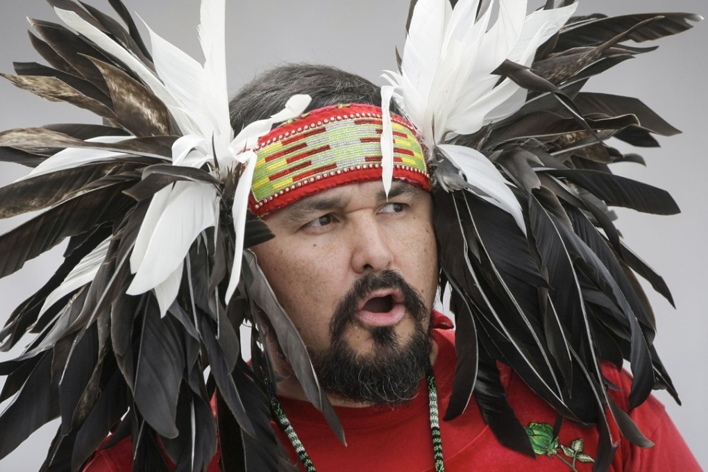 A singer sings a traditional aboriginal song during the Canada Place National Aboriginal Day celebrations in Vancouver on June 17. Photo: Xinhua