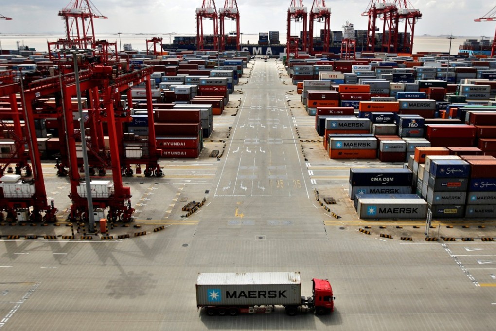 A truck drives past the container area at the Yangshan Deep Water Port, part of the Shanghai Free Trade Zone. Photo: Reuters