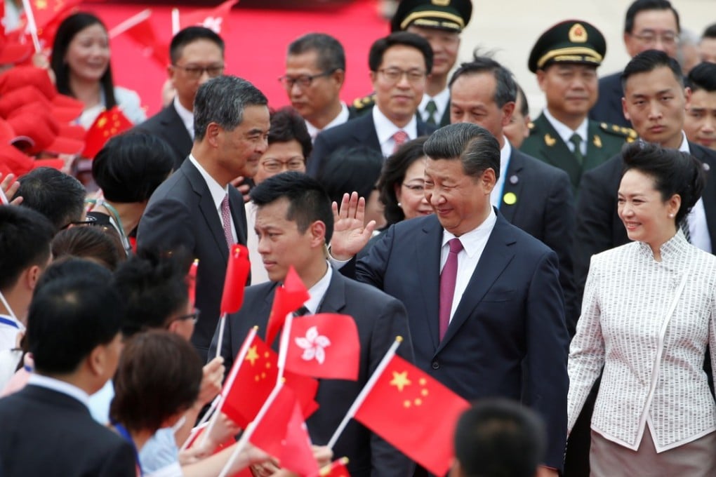 President Xi Jinping and his wife Peng Liyuan arriving at Hong Kong International Airport. Photo: Reuters