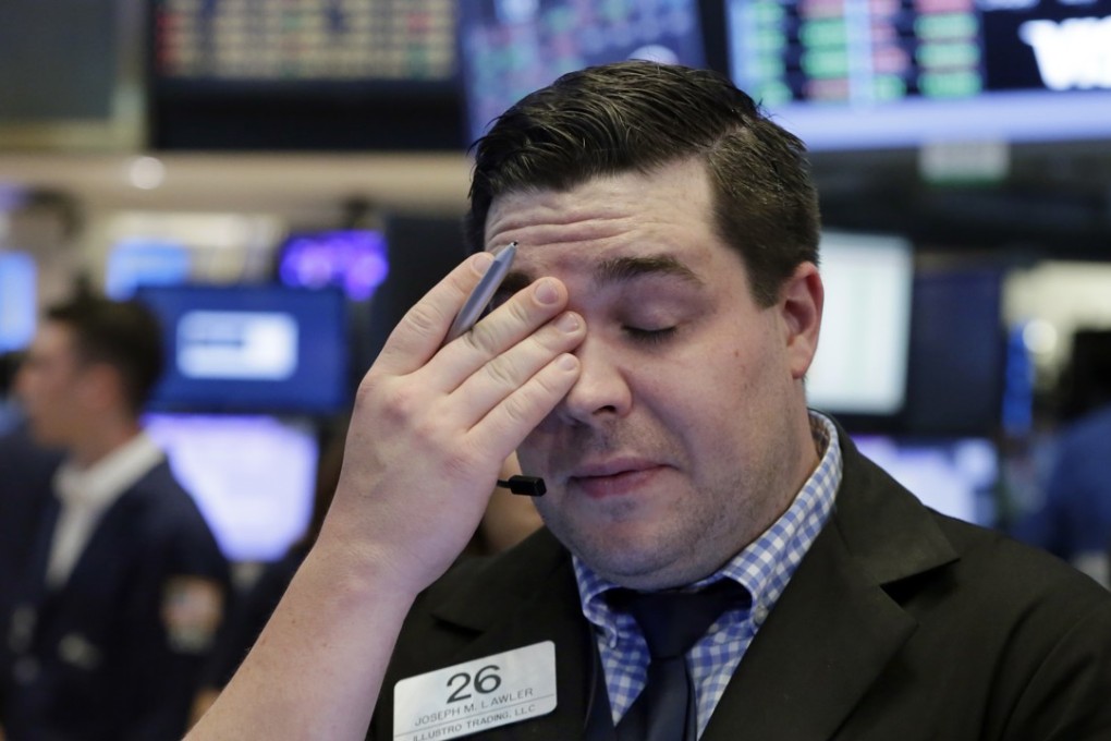 Trader Joseph Lawler strokes his forehead as stocks fell on Thursday, June 29, 2017. Photo: AP