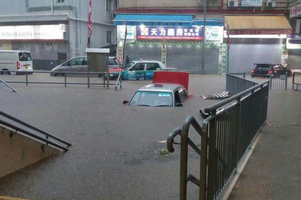 Vehicles seen partially submerged during rainstorms in Hong Kong in May, 2017. The gross value of insurance policy premiums in 2016 stood at HK$448.8 billion (US$57.55 billion), up 763 per cent from HK$52 billion in 1997, according to official figures. Photo: SCMP Handout