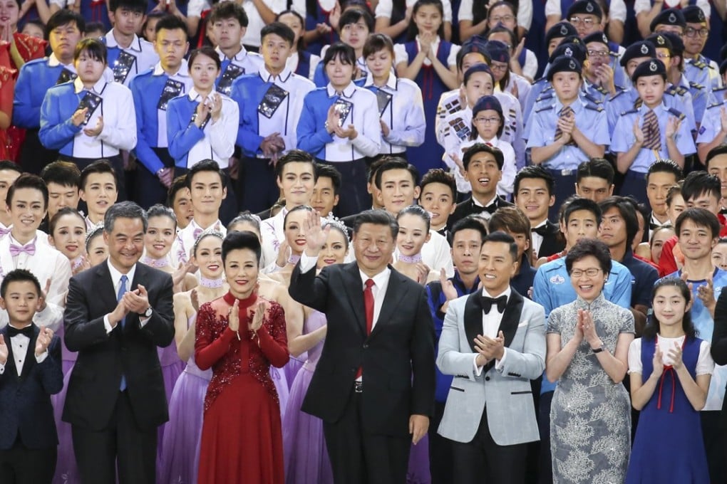 Chinese President Xi Jinping (centre) is all smiles on stage with Hong Kong Chief Executive Leung Chun-ying and his successor Carrie Lam, flanked by celebrities from the city and mainland. Photo: Dickson lee