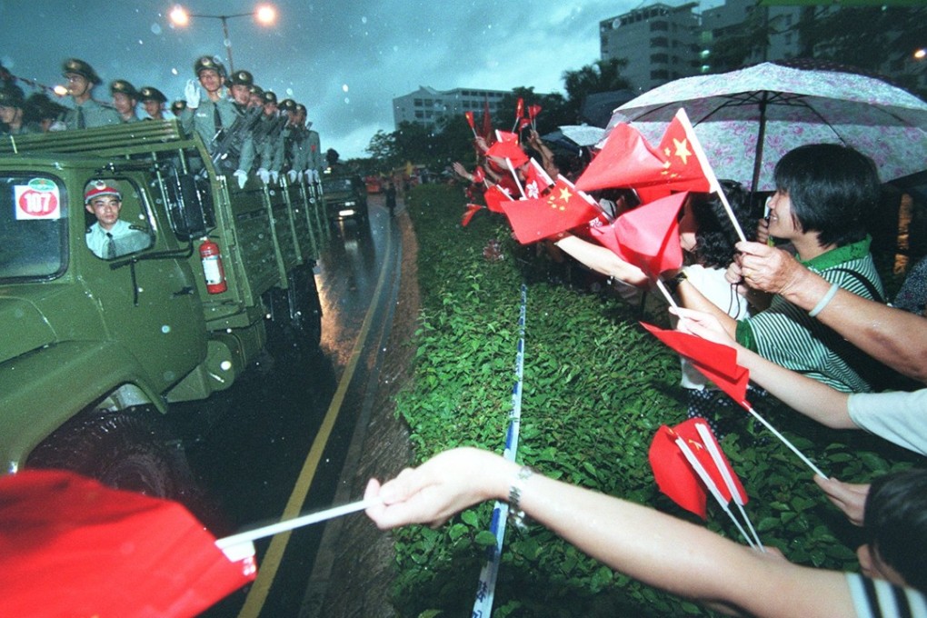 People's Liberation Army soldiers are greeted by Sheung Shui residents after entering Hong Kong on July 1, 1997. Photo: Oliver Tsang
