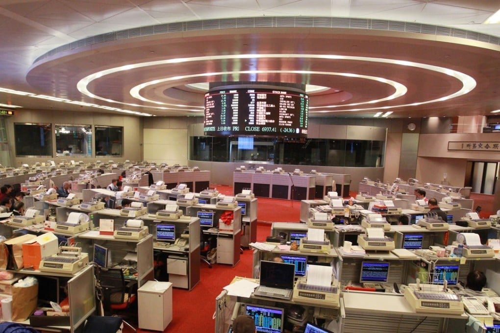Floor traders are seen at the Hong Kong stock exchange in Central. Photo: SCMP
