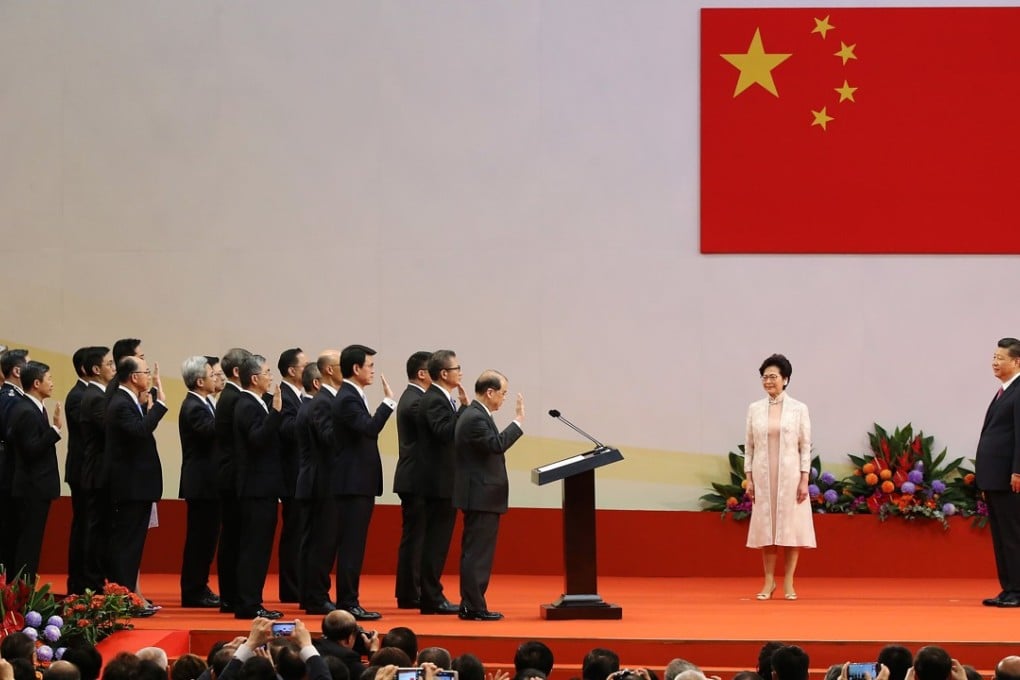 President Xi Jinping (right) swears in Hong Kong's new cabinet members. Photo: Sam Tsang