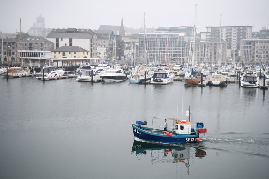 A fishing boat sailing out of Plymouth harbour. Photo: Reuters