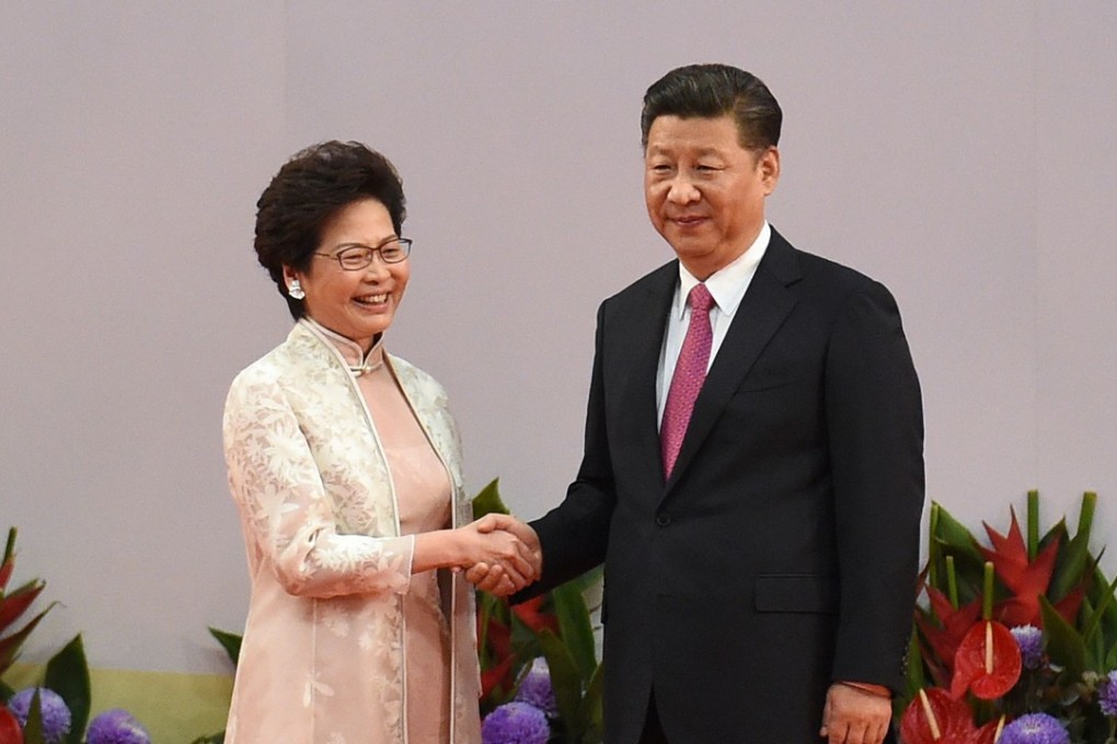 President Xi Jinping shakes hands with Carrie Lam, Hong Kong’s new chief executive. Photo: AFP