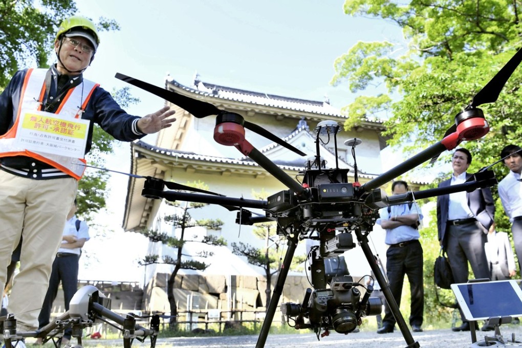A drone used by an architectural office to capture images of the rooftop and walls of a turret at Osaka Castle, with the aim of offering renovation services for cultural assets. Photo: Kyodo