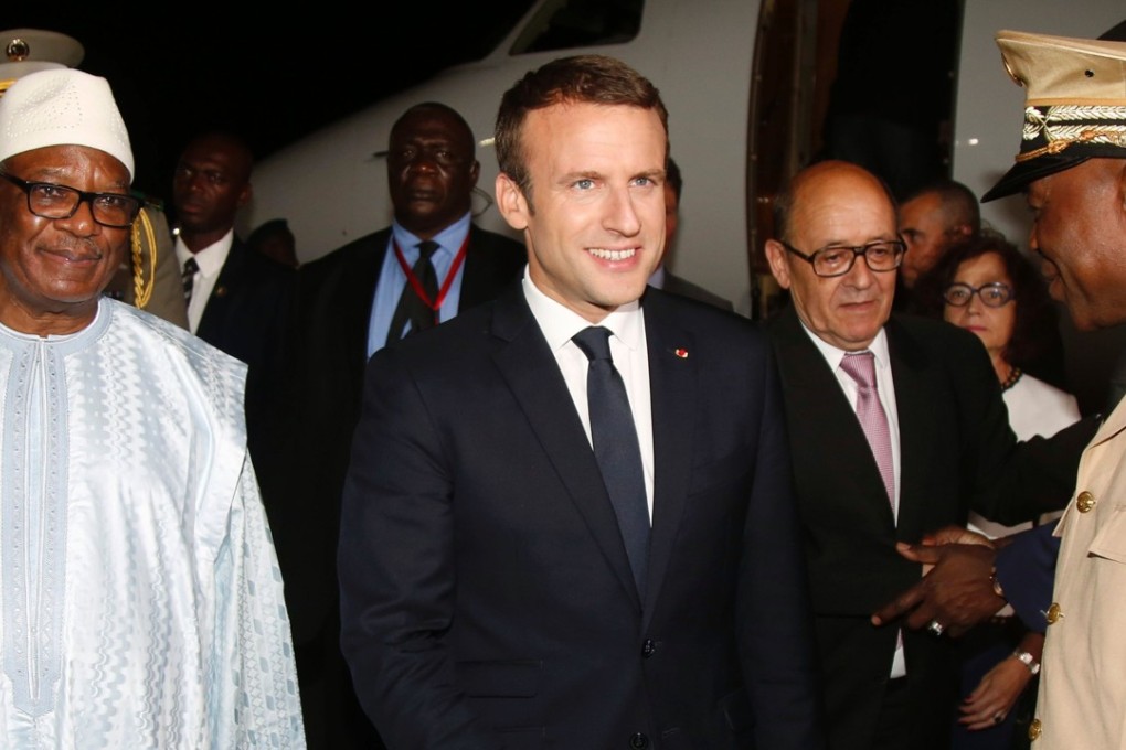 French President Emmanuel Macron with Malian officials. Photo: AFP