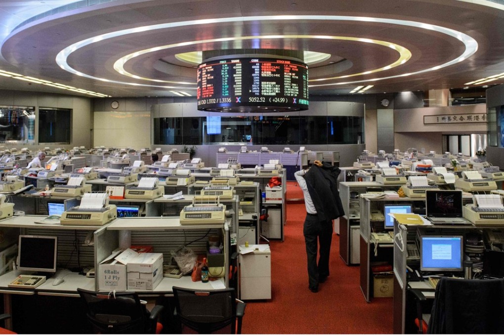 Buyers outnumbered sellers in every trading category last week with 47 companies that recorded 206 director purchases worth HK$217 million versus 15 firms with 71 disposals worth HK$107 million. Photo: AFP