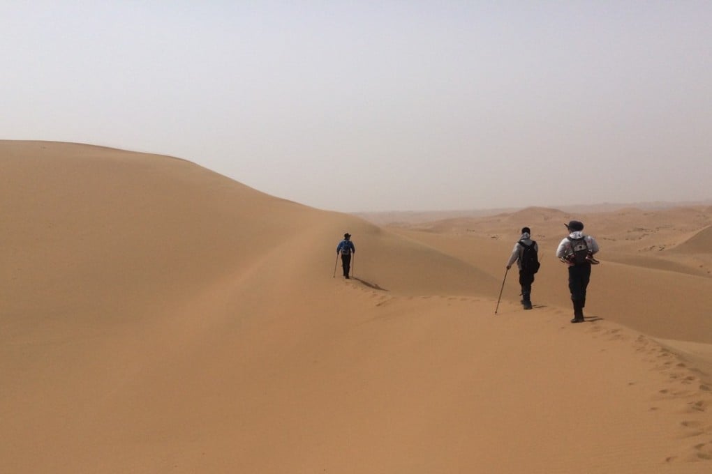 Hikers trek through the Tengger Desert, Inner Mongolia. Photo: Simina Mistreanu