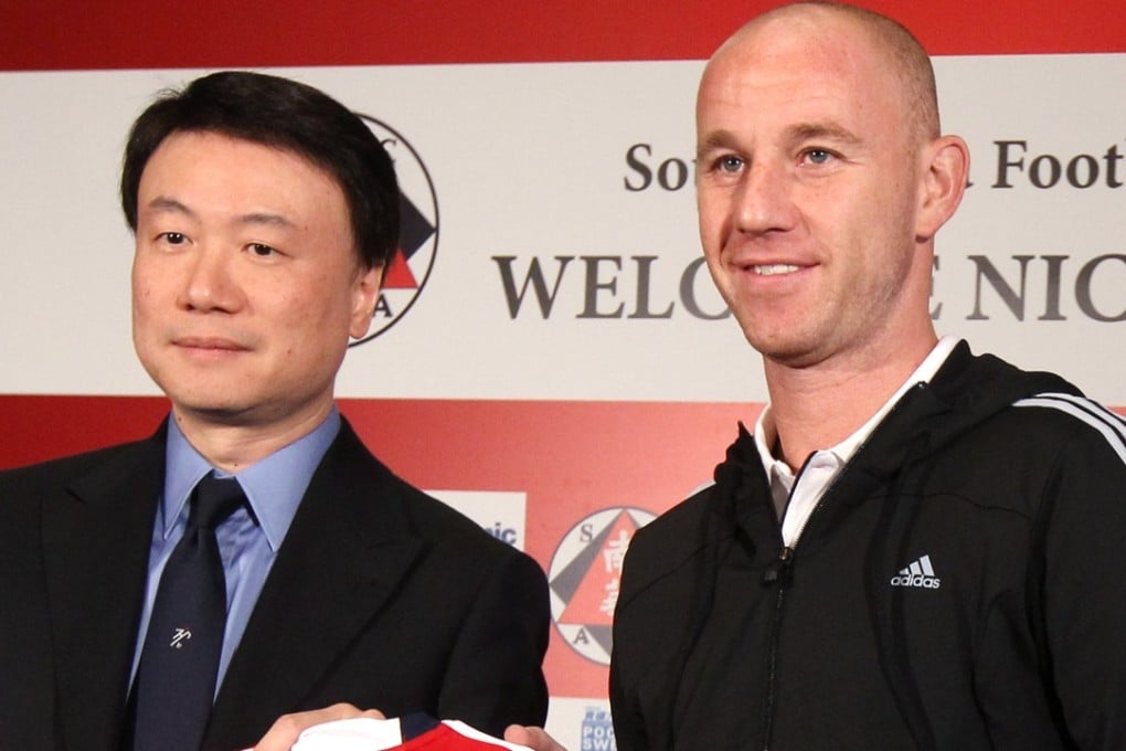 Nicky Butt with then South China convenor Steven Lo Kit-shing as he completes his transfer to the club in 2010. Photo: Sam Tsang